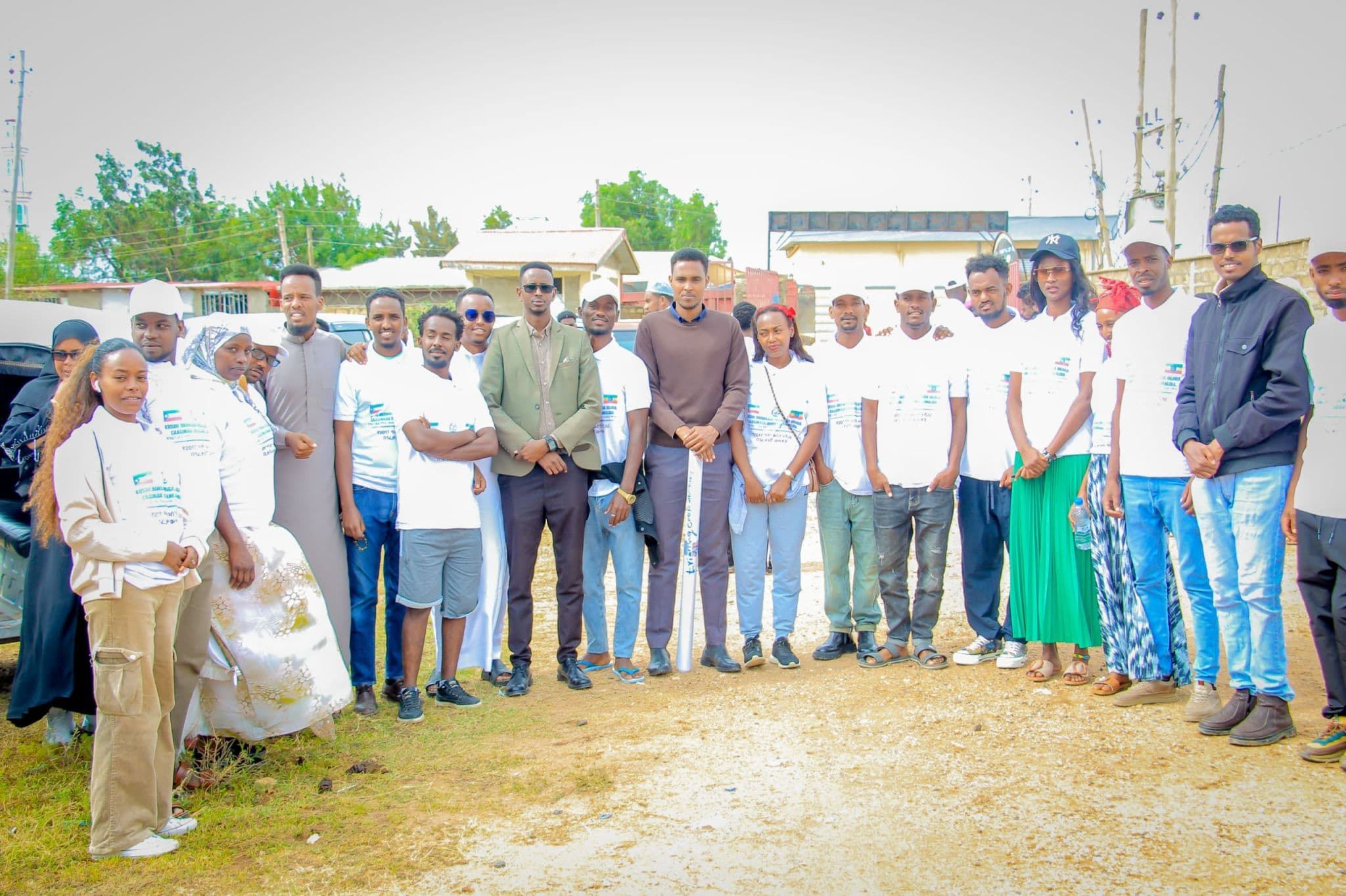SHIFA's youth-led team standing together after a community health event in the Somali Region