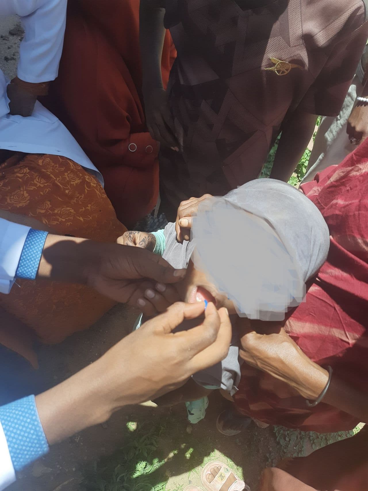 Children lined up during a SHIFA vaccination and nutrition campaign